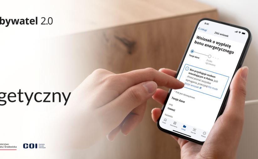 Dłonie trzymają telefon komórkowy, napis bon energetyczny, godło Polski, napis mObywatel 2.0