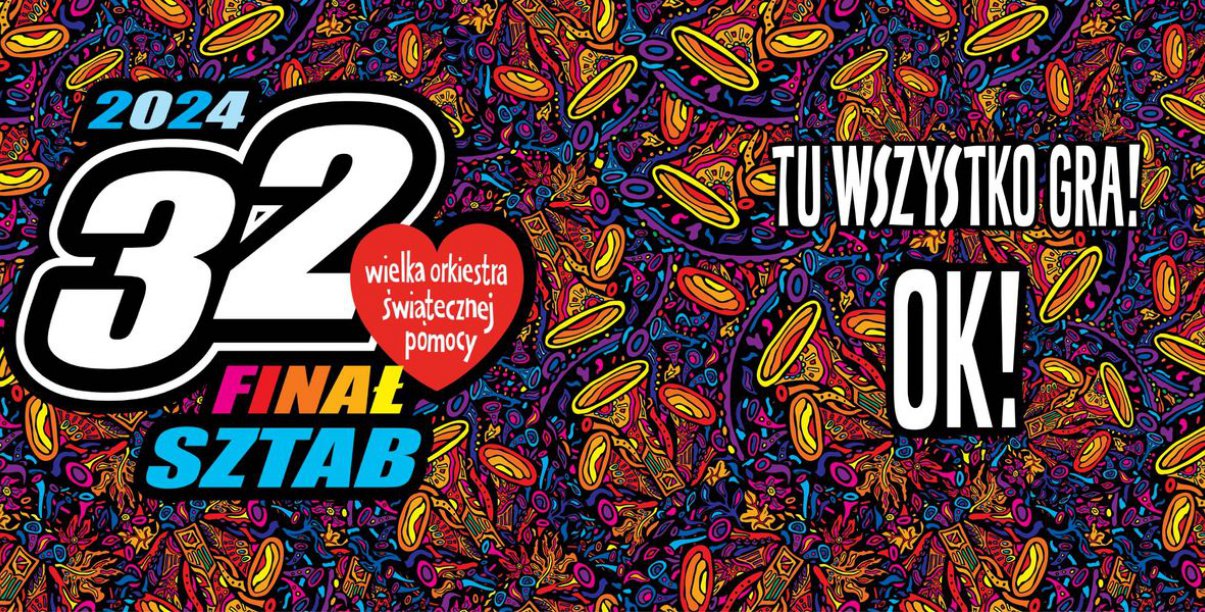 Napis Tu wszystko gra na wielokolorowym tle