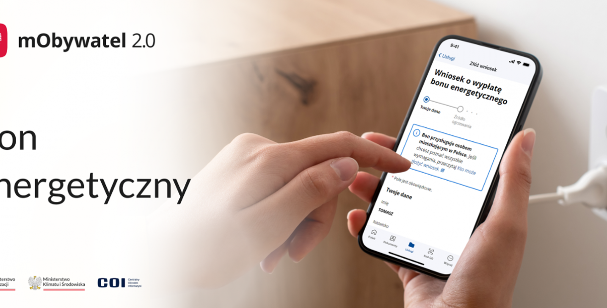 Dłonie trzymają telefon komórkowy, napis bon energetyczny, godło Polski, napis mObywatel 2.0