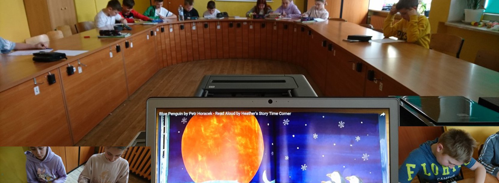 Ekran laptopa, na drugim planie ucnziowie przy stole