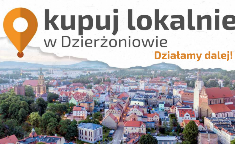 Zdjęcie miasta z lotu ptaka i napis Kupuj Lokalnie - dziłamy dalej