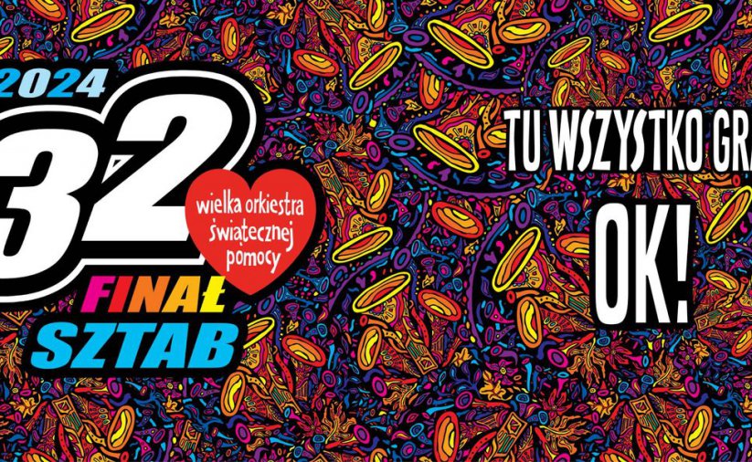 Napis Tu wszystko gra na wielokolorowym tle